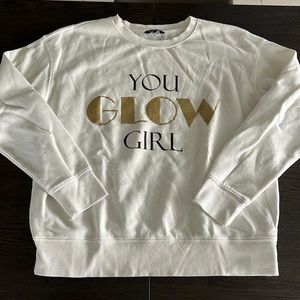 White “you glow girl” sweatshirt